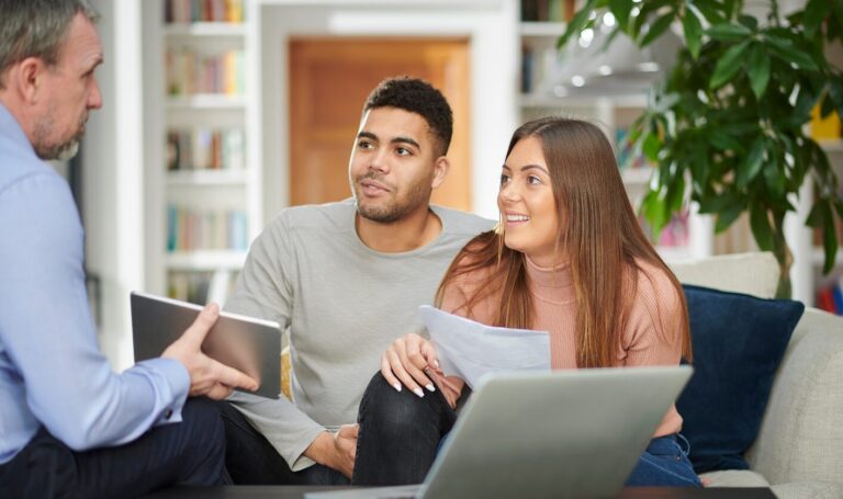 Sellers reviewing pricing advice before setting their asking price.