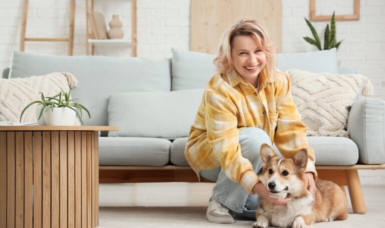 Tenant in a Midlands rental home sitting with her dog in a bright living room, reflecting growing demand for pet-friendly properties under new 2026 rules